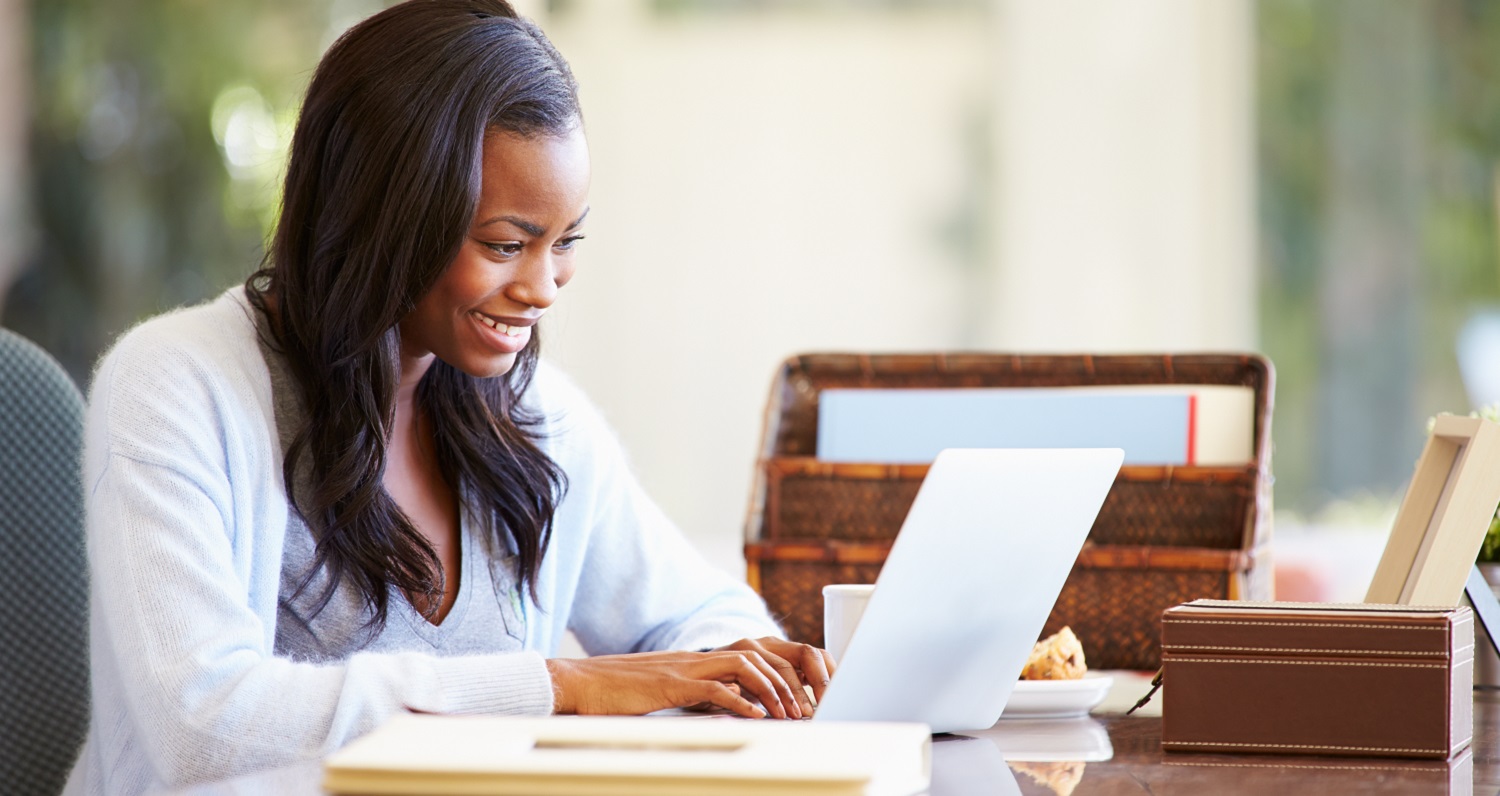 woman using computer in home office