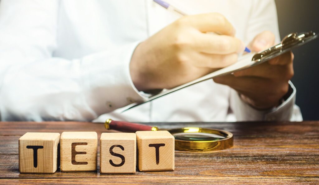 Man makes a test and writes results to a paper