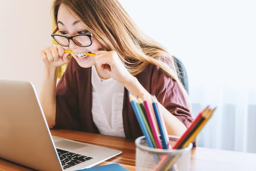young college girl student using E-learning system