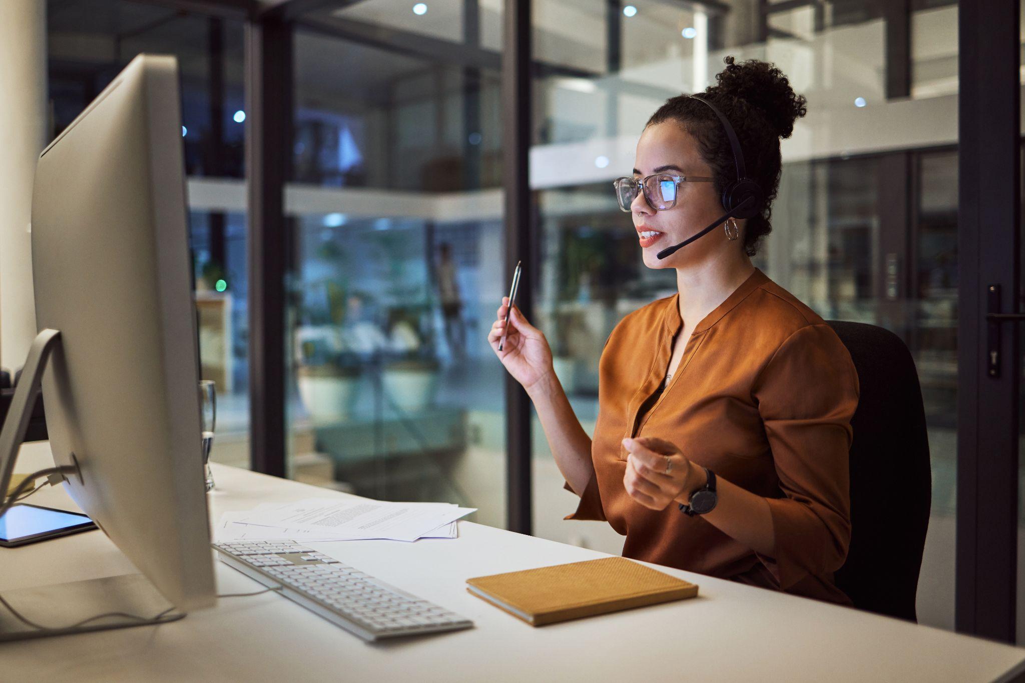 Insurance agent talking on a headset to clients