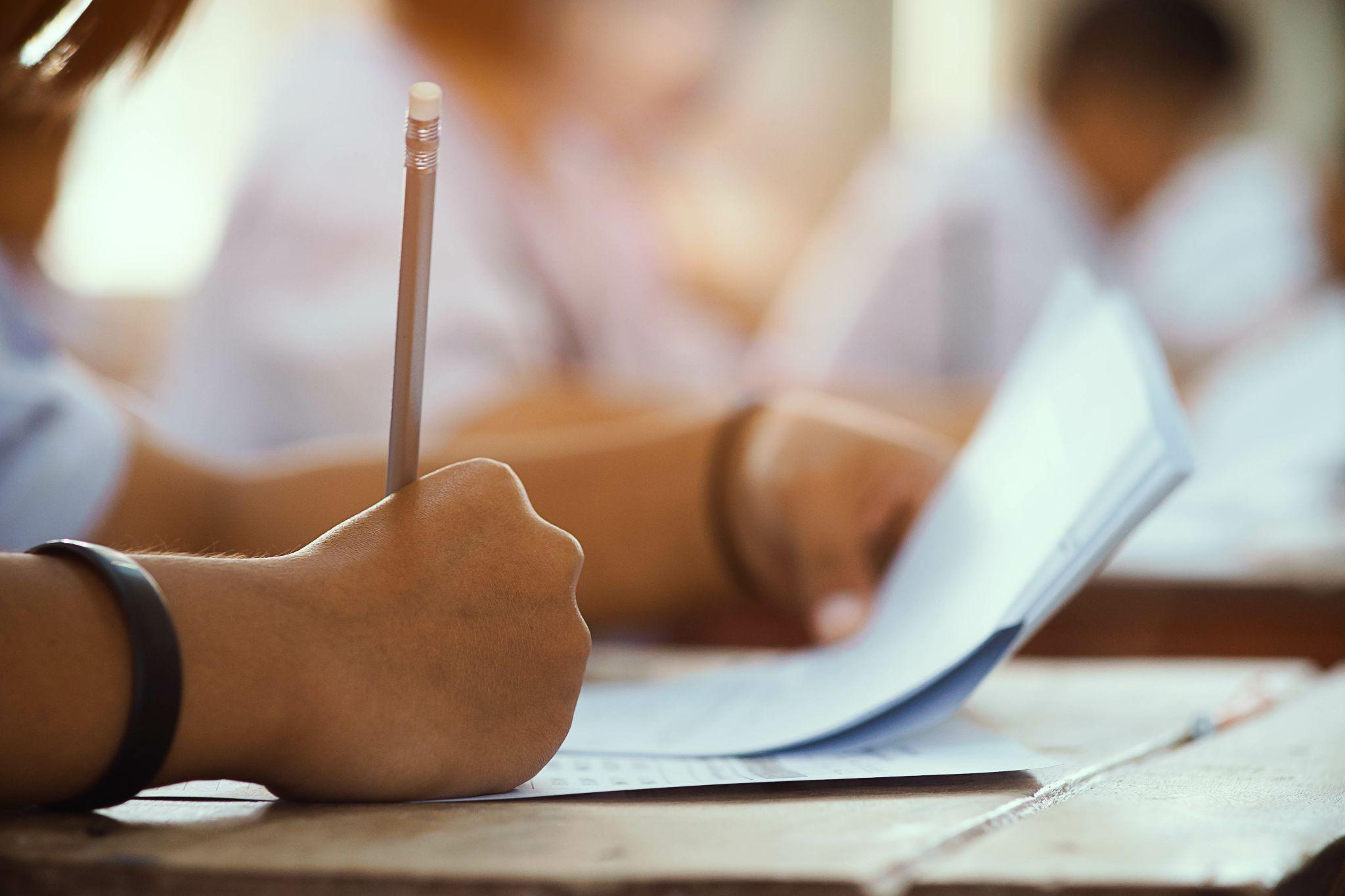 person taking a written exam