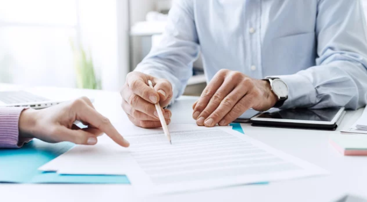 Business people negotiating a contract