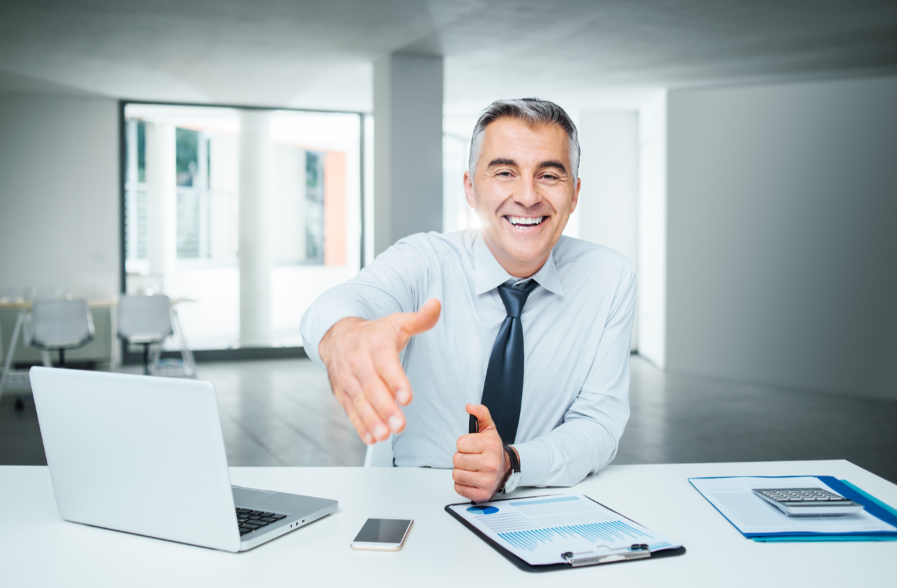 Businessman giving an handshake